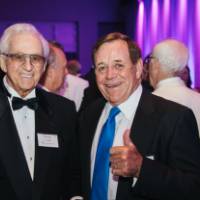 Norm Leven with guest at Enrichment.